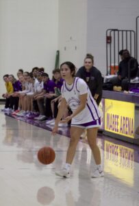 A girl on a floor with a ball
